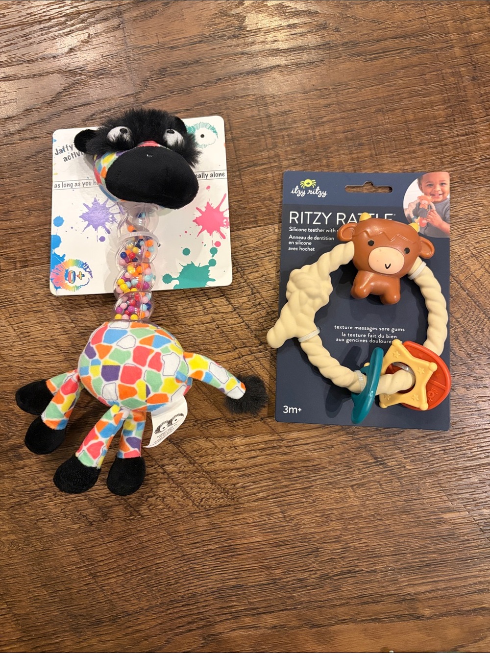 Set of two baby toys, rattle/teether style, new in packaging